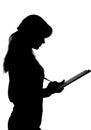Black and white silhouette of a woman working in an office with a folder for sheets and a pen in the hands Royalty Free Stock Photo