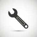 Black and white silhouette of a wrench against a light gradient background. The Royalty Free Stock Photo