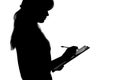 Black and white silhouette of a young woman thinking whether to accept the offer and whether to sign a document which is already Royalty Free Stock Photo