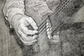 Black and white sketch of a hand playing a classical guitar