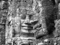 Black and white smiling faces carved into the rock at Bayon Temple, Angkor Wat Cambodia. Royalty Free Stock Photo