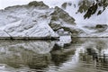 Black and White Snowing Floating Iceberg Arch Reflection Paradise Bay Skintorp Cove Antarctica