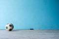 Black and white soccer ball on blue background, old soccer ball Royalty Free Stock Photo