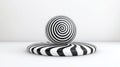 Black and White Spiral Patterns on a Sphere and Oval Base in Minimalist Environment Royalty Free Stock Photo