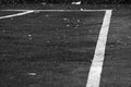 Monochrome sports markings on an abandoned stadium