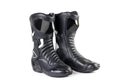 Black and white sports motorcycle boots. Isolated on a white background Royalty Free Stock Photo