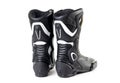Black and white sports motorcycle boots. Isolated on a white background Royalty Free Stock Photo