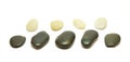 Black and white stones row on white backg Royalty Free Stock Photo