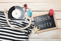 Black-white striped beach bag, black chalk board, vinyl record and summer decor Royalty Free Stock Photo