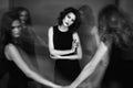 Black and white studio photo of five women in black dresses. Blu Royalty Free Stock Photo