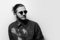 Black and white studio portrait of young handsome man, wearing shades. Royalty Free Stock Photo