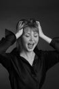 Black and white Studio portrait of a young woman with short hair in a black blouse Royalty Free Stock Photo