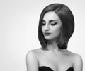 Black and white studio shots of a classy young woman with short Royalty Free Stock Photo