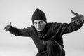 Black and white stylish modern epic portrait of bboy on a white background. Breakdance and hiphop dancer. Mysterious and