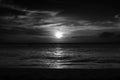 Dramatic Black and White Sunset over Ocean and Beach Royalty Free Stock Photo