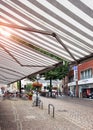 Aachen, Germany - July 31, 2022: Black and white sunshade awning marquis in the open air