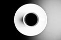 Black and white symmetry, top view of cup of black coffee