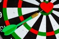 Black white target with dart in heart love symbol as bullseye Royalty Free Stock Photo