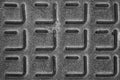 Black and white texture of metal plate with embossed square patterns Royalty Free Stock Photo