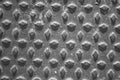 Black and white texture of metal plate with irregular embossed patterns Royalty Free Stock Photo