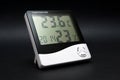 Black and white thermometer on black. Royalty Free Stock Photo