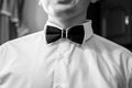 Black and white tiebow on the grooms neck Royalty Free Stock Photo