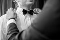 Black and white tiebow on the grooms neck Royalty Free Stock Photo