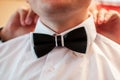 Black and white tiebow on the grooms neck Royalty Free Stock Photo