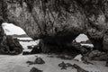 Black and white tone of abstract background of natural stone with hole on the beach. Royalty Free Stock Photo