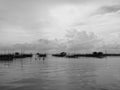 Black and white tone of homestay and floating basket in lake at Kohyo, Songkhla, Thailand with beautiful sky and clouds. This is t Royalty Free Stock Photo