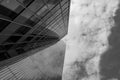 Black and white tone, Low angle view of mixture material exterior facade and wall of glass modern office buildings. Royalty Free Stock Photo