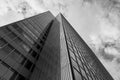 Black and white tone, Low angle view of mixture material exterior facade and wall of glass modern office buildings. Royalty Free Stock Photo