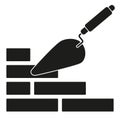 Black and white trowel silhouette on brick wall Royalty Free Stock Photo