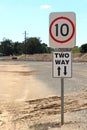 Black and white Two Way sign with arrows and speed limit Royalty Free Stock Photo