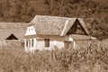 Black and white. Typical rural peasant houses in the village Alma Vii Almen Transylvania, Romania. Royalty Free Stock Photo