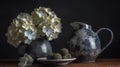 a black and white vase with white flowers and a plate of strawberries on a table with a bowl of strawberries on the side