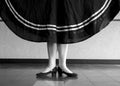 Black and white version of Character Ballet dancer in first position holding her skirt Royalty Free Stock Photo