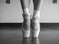 Black And White Version Of A Close Up Of A Ballet Dancer`s Bare Feet In Pointe Shoes