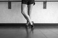 Black and white version of Jazz shoes on a jazz dancer with foot crossed over