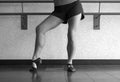 Black and White version of Posing in Jazz shoes at the barre in dance class Royalty Free Stock Photo