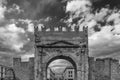 Black and white view of the Arch of Augustus in Rimini, Italy, the oldest extant Roman arch, against a dramatic sky Royalty Free Stock Photo