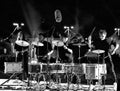 Black and white view of a band with young musicians playing drums in Muscat, Oman