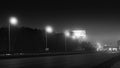 Black and white view of city highway traffic at night. Stock footage. Black and white speed limit camera stands on Royalty Free Stock Photo