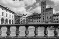 Black and white view of the famous Piazza Grande square in the historic center of Arezzo, Tuscany, Italy, against a beautiful sky Royalty Free Stock Photo