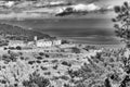 Black and white view of a glimpse of the island of Gorgona, Italy
