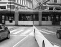 Black and white view on street traffic with surreal crossing reflectiom in bus window. urban concepn backgruond. Royalty Free Stock Photo