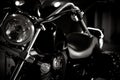 Black and white vintage photo of chopper bike details, chromed, with soft light and reflections, with side leather bags. Royalty Free Stock Photo