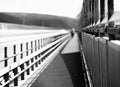 Black and white walking man on Norway bridge background