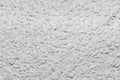 Black and white whitewashed concrete wall interspersed with stones Royalty Free Stock Photo
