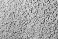 Black and white whitewashed concrete wall interspersed with stones Royalty Free Stock Photo